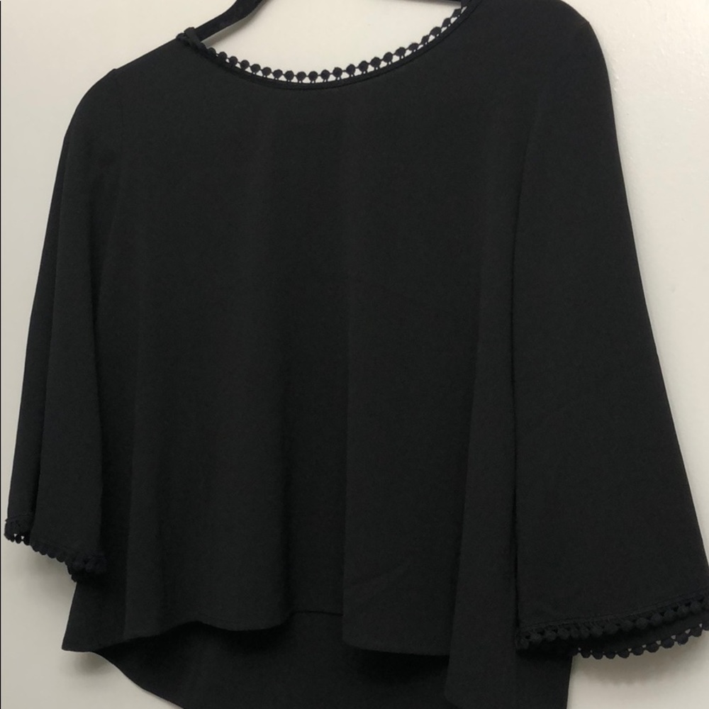 Black short cut blouse with detailed neck
